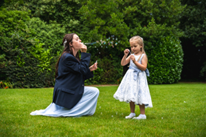 bridesmaids blowing bubbles