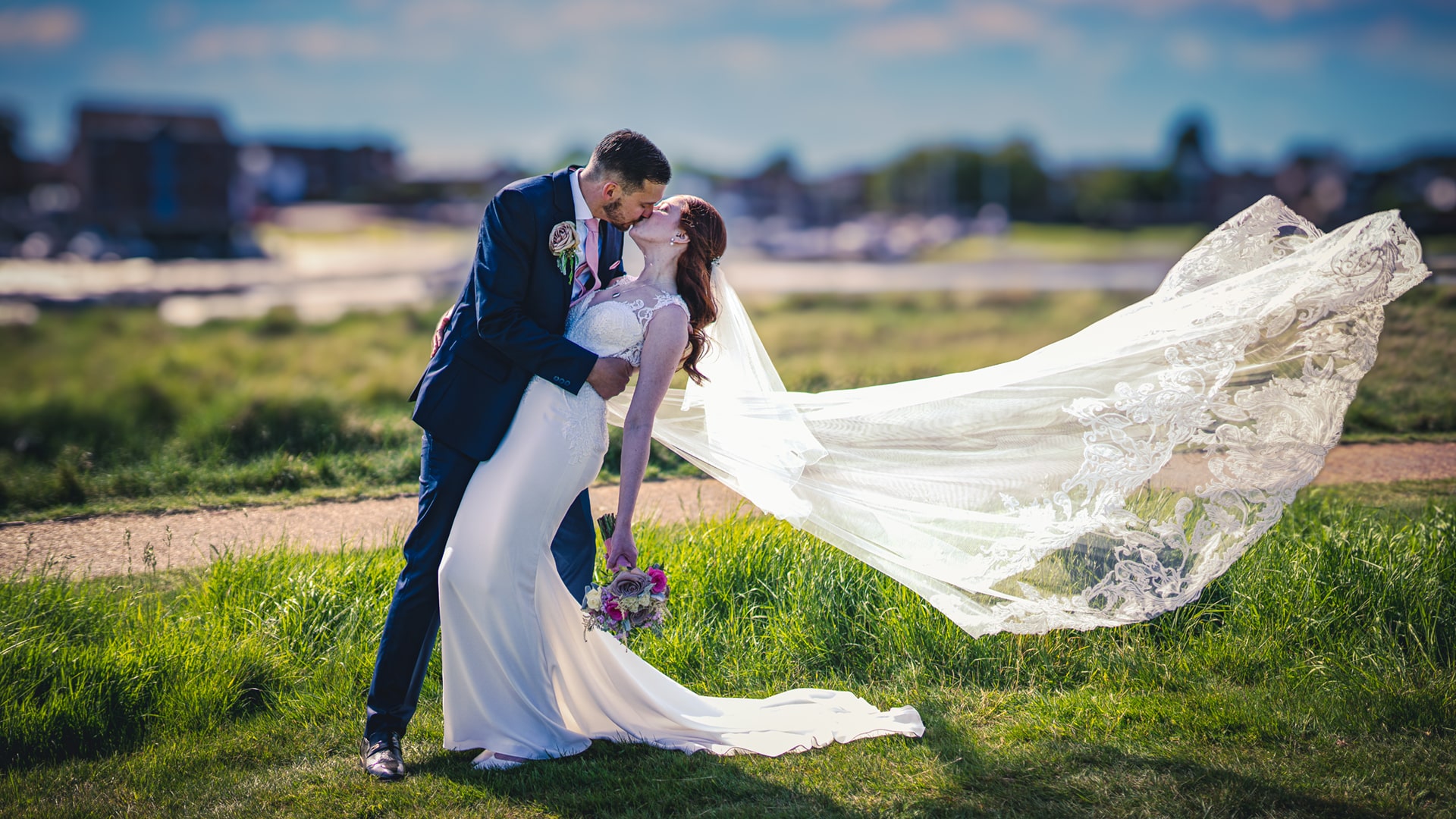 wedding couple posed kissing on the golf course at cams hall