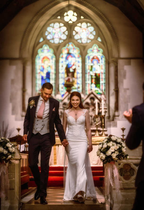 jsut married wedding couple walking back down the isle