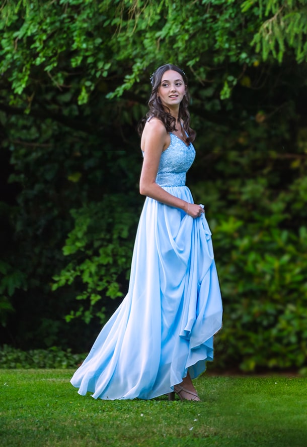 bridesmaid walking on the grass with blue dress