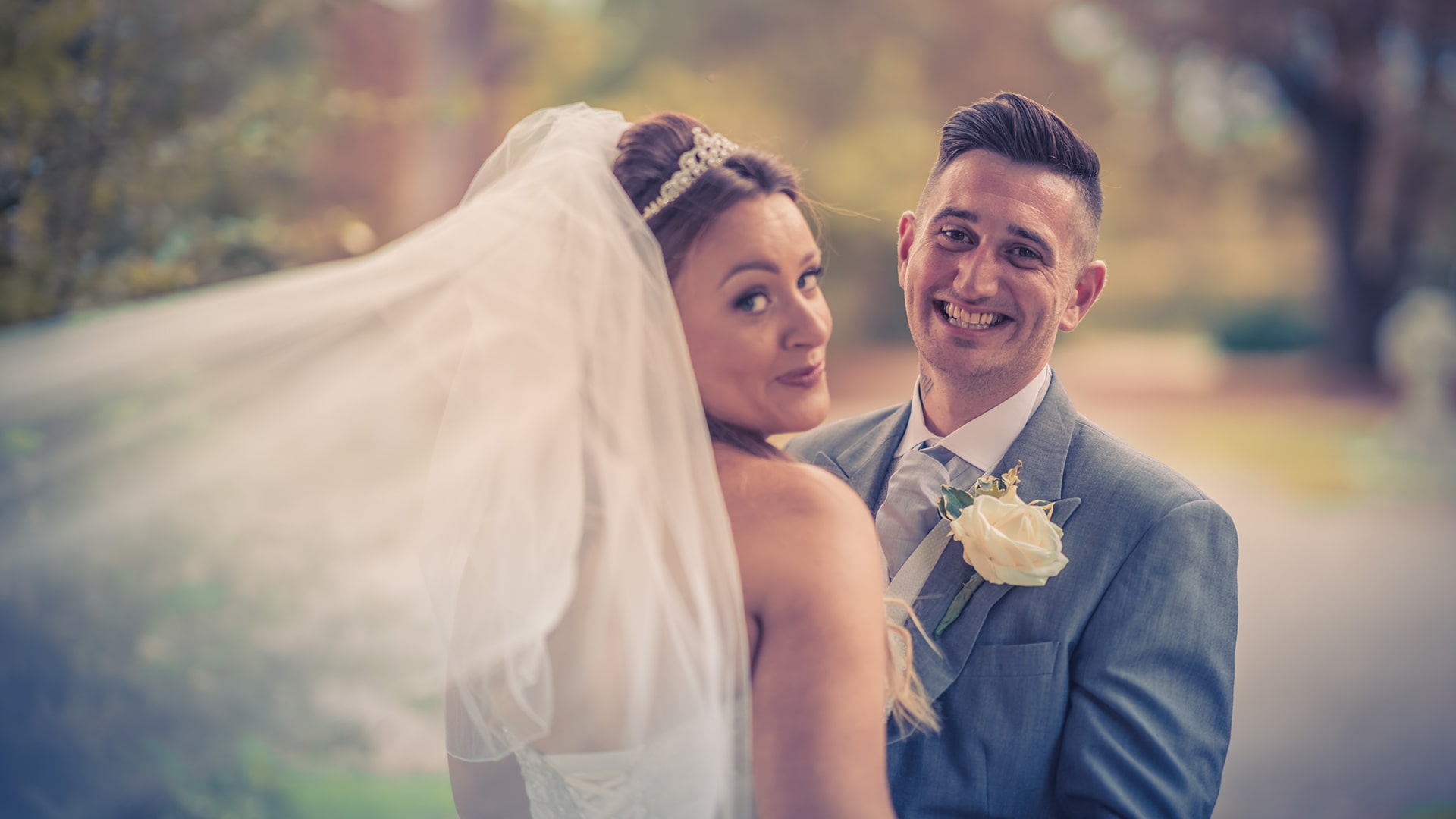 bride and groom posing for the camera