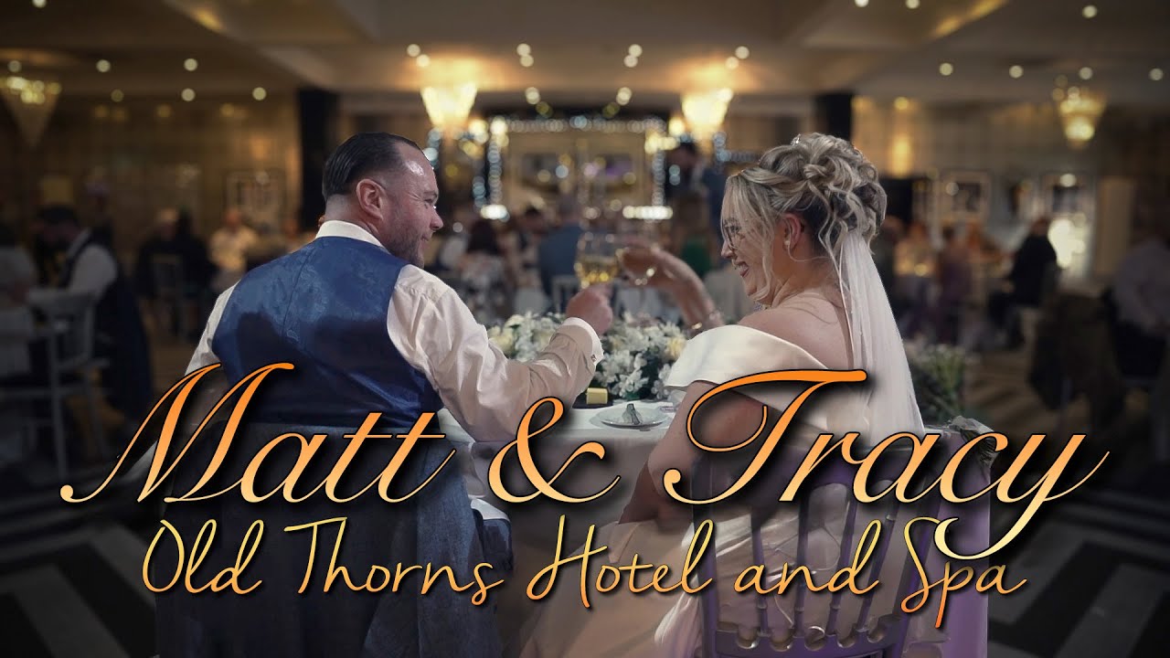 YouTube Video image of a wedding couple sat at a table